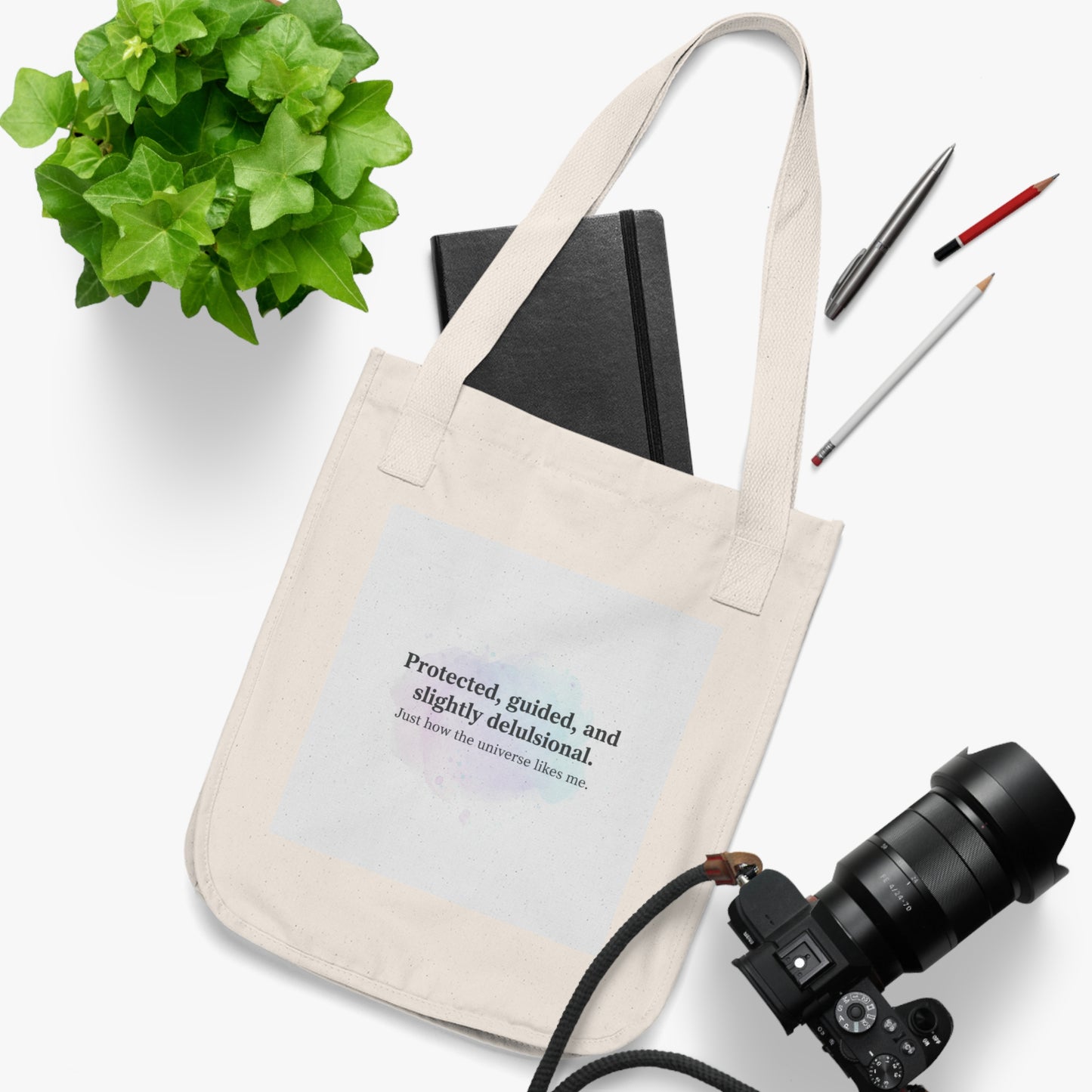 Canvas Tote Bag — "Protected, guided, and slightly delusional" Inspirational Quote Tote